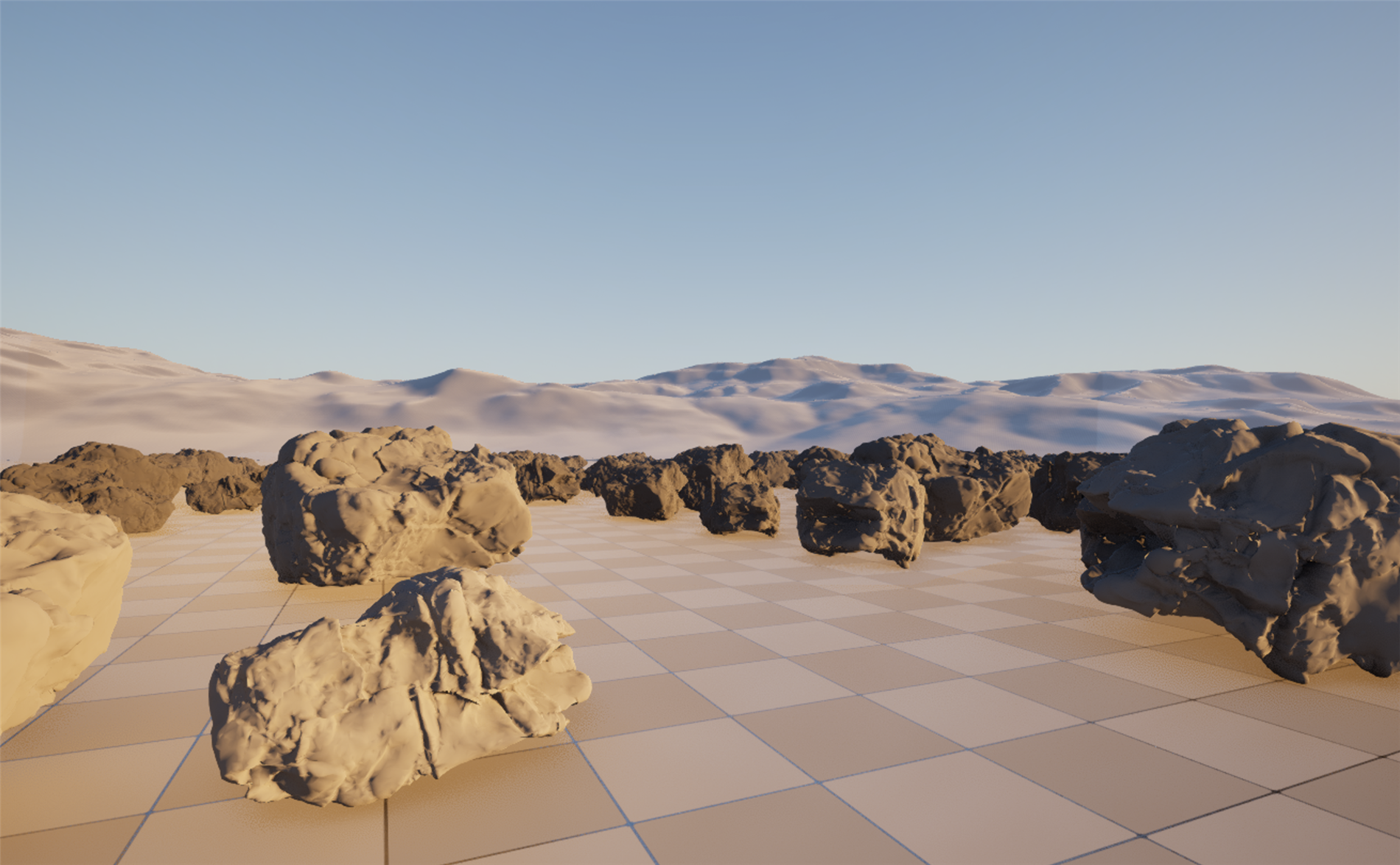 A real-time desert scene captured live in the course's Unreal project, showing a field of scanned-style boulders scattered across the sand by a PCG graph. Dozens of rocks of varied sizes and random orientations sit spread across the flat desert basin, receding toward a hazy ring of dunes under a low warm sun, with a clear graded sky above. The rocks are all the same Nanite mesh instanced many times, placed procedurally rather than by hand, and lit by Lumen.