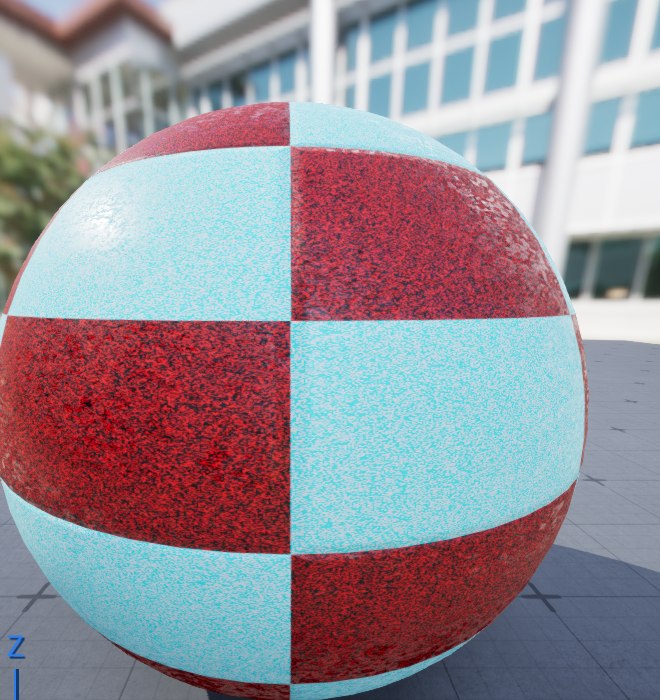 The Material Editor preview sphere in UE 5.8 rendered with the finished textured material: a red and cyan grid texture tiled several times across the surface, with a grainy roughness variation breaking up the highlights and normal-map surface relief, reflecting the surrounding scene.